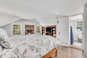 Farmhouse bedroom in custom home by Nordic Construction